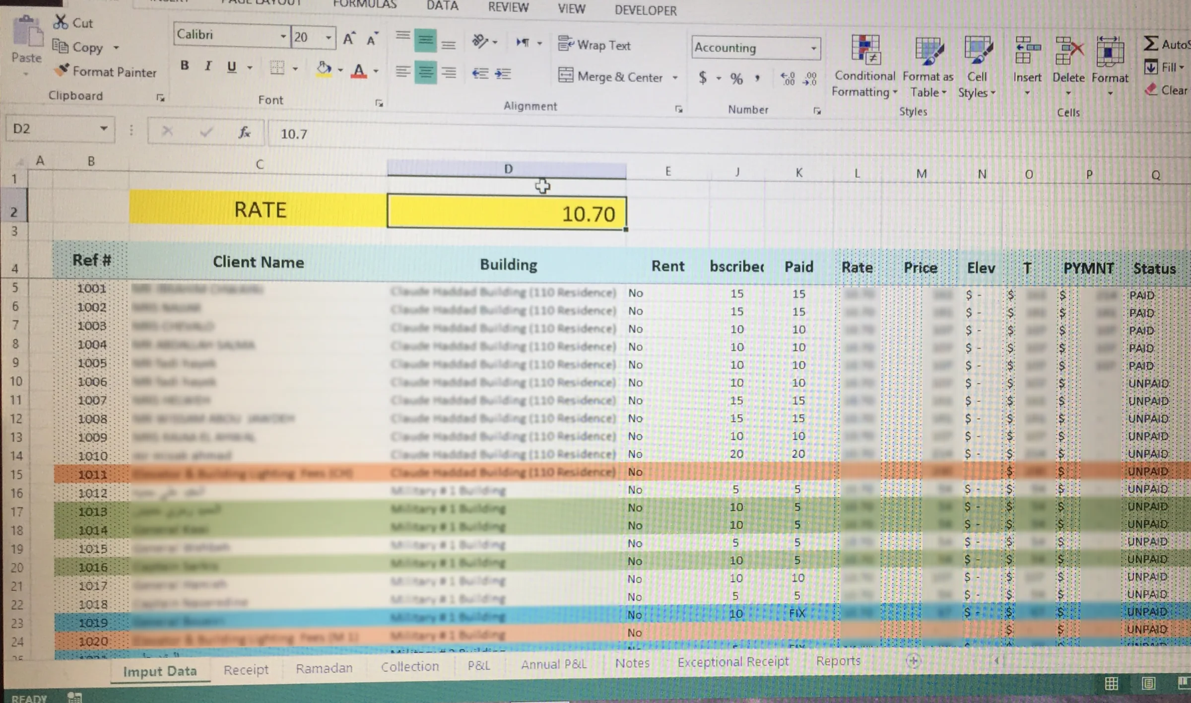 A photographed Excel subscriber table with a single monthly rate, subscriber details, calculated prices, payment values, and paid or unpaid status — the first working model of the billing system